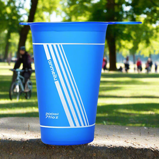 Blue cup with white text and design on a white background