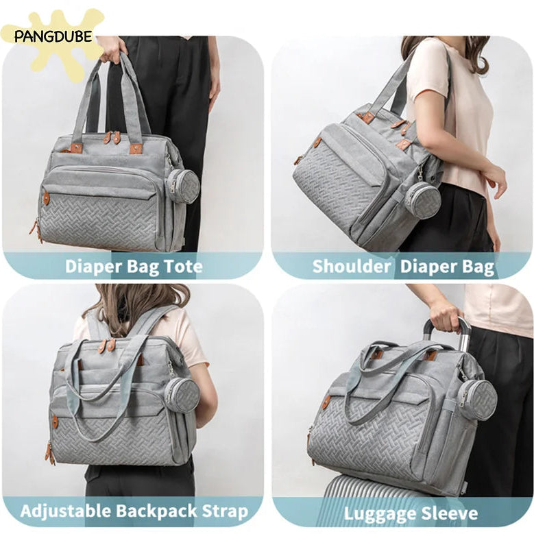 Gray diaper bag with various carrying options shown on a white background