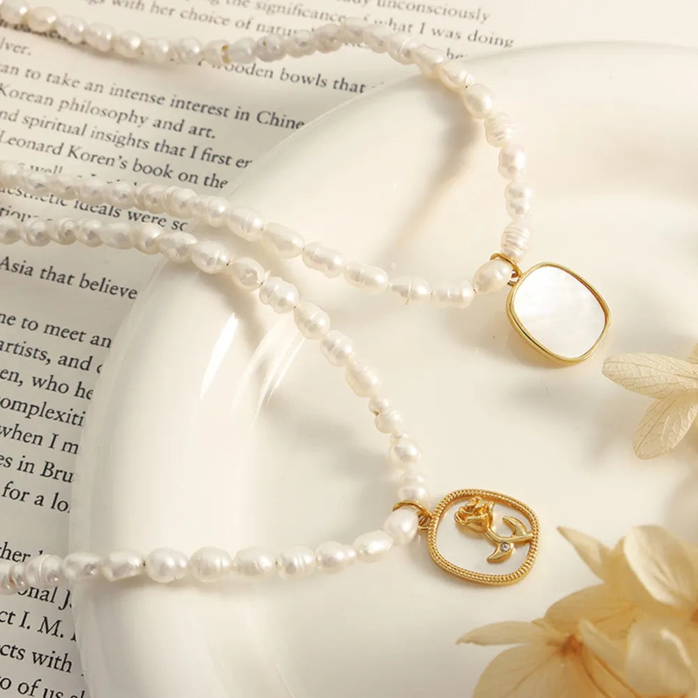 French Baroque freshwater pearl chain oval plate inlaid with zircon colored shell relief flower necklace