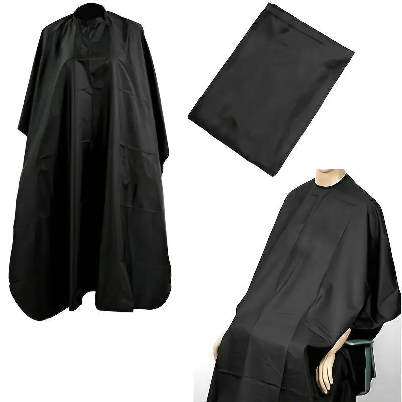 Black barber cape and hairdressing apron on a white background
