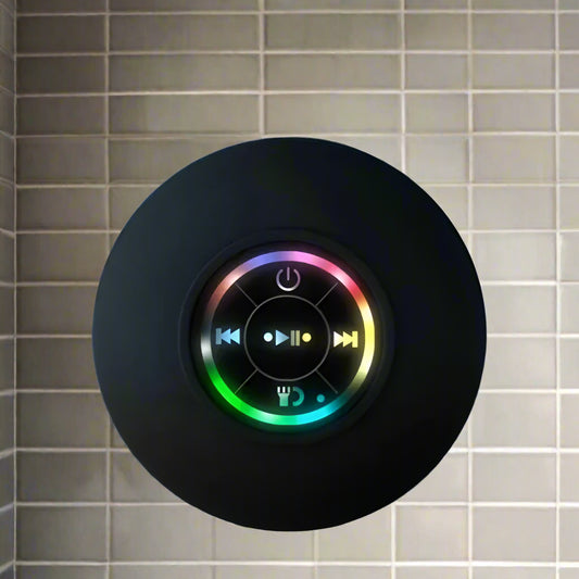 Black circular device with colorful LED display on a blue background