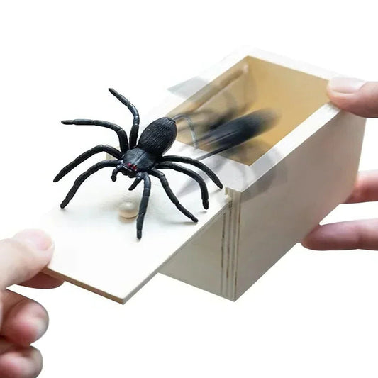 Black spider toy popping out from a book