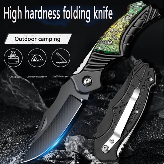 Folding knife with green and black handle on a dark background