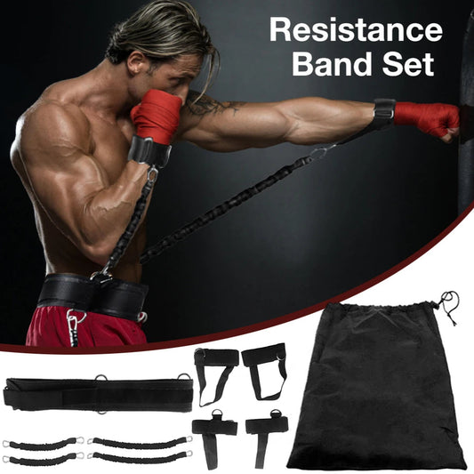 Man exercising with resistance bands and accessories on a black background