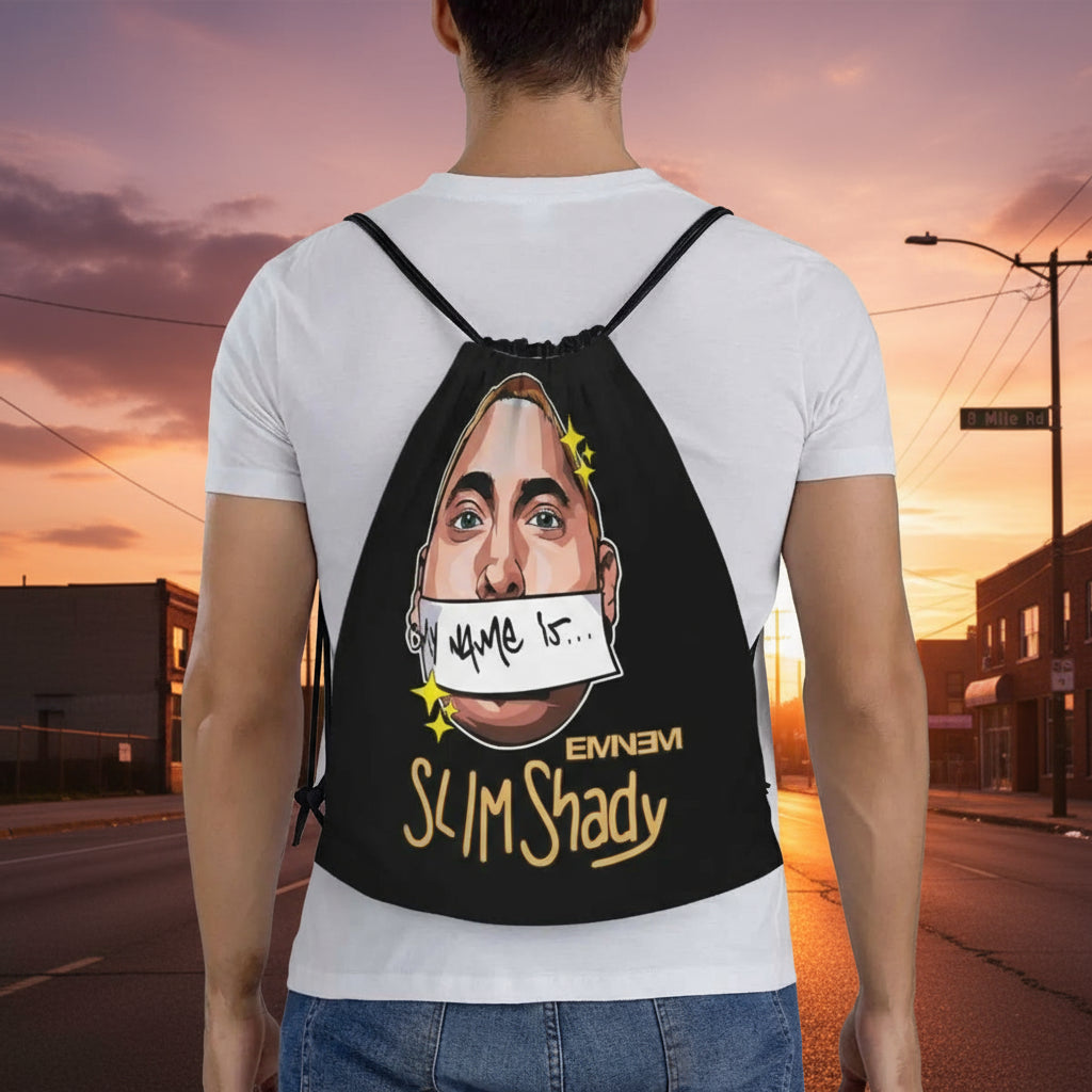 Person wearing a backpack with Eminem graphic design on a white background

