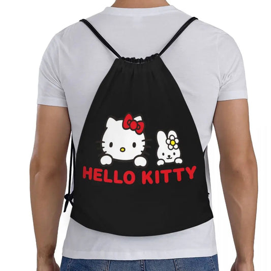 Person wearing a black drawstring bag with Hello Kitty design on a white background