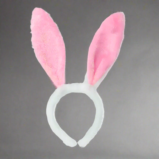 Pink bunny ears headband on a white background