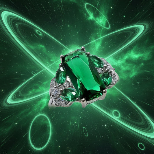 Ring with a large green gemstone and smaller diamonds on a white background