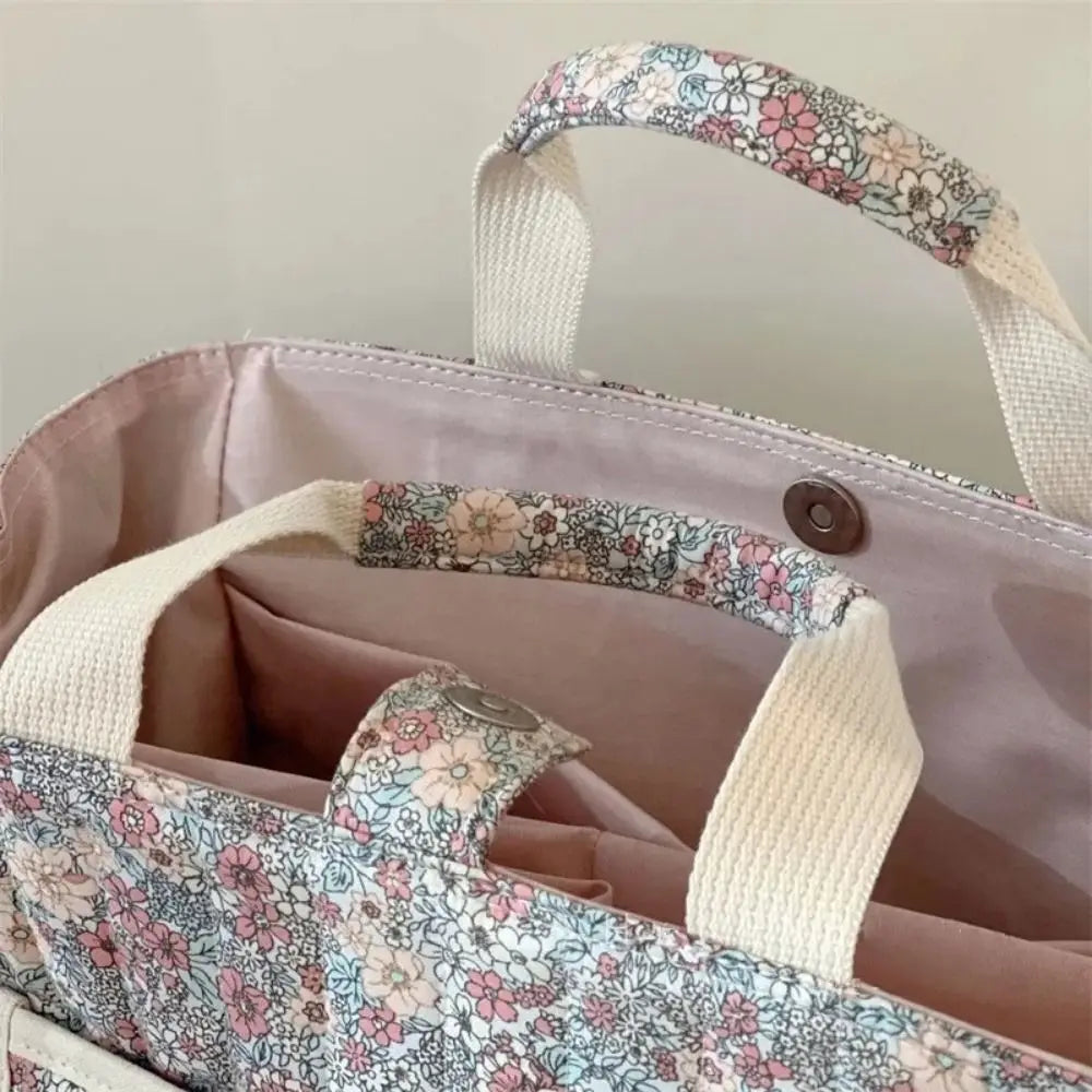 BloomCarry Luxe — Floral Cotton Mummy Bag for Modern Moms