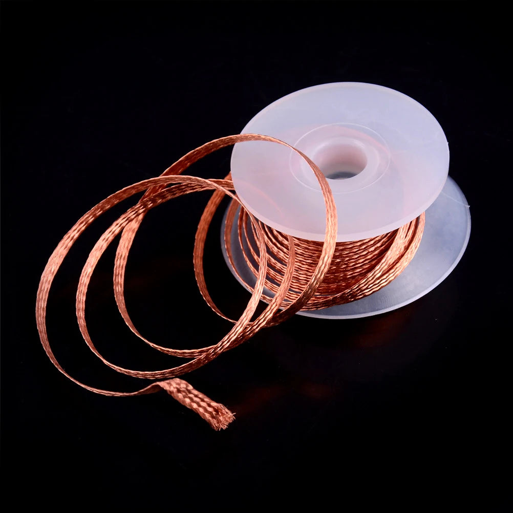 Spool of copper wire on a black background